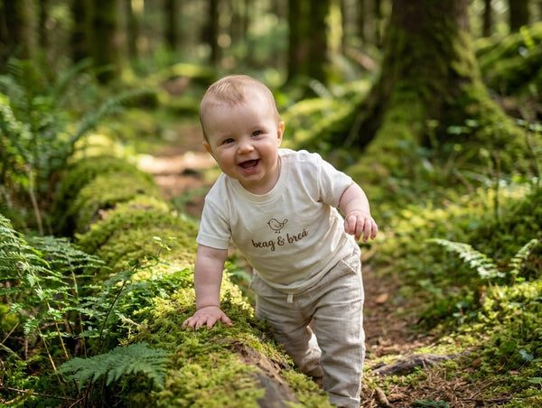 Child in motion wearing oatmeal t-shirt with beagbrea design