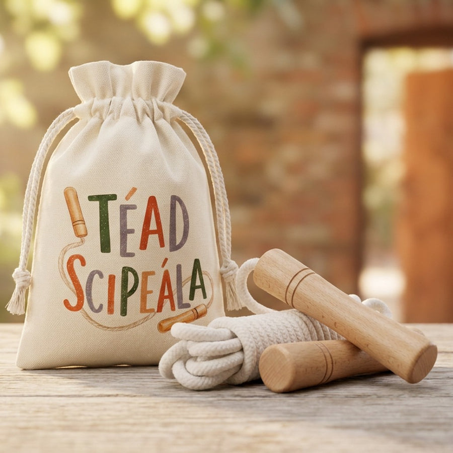 Téad Scipeála bag and skipping rope on a wooden table by a brick archway