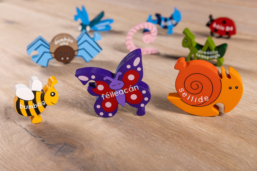 Child fitting hand-painted insect pieces into the Creepy Crawlies jigsaw