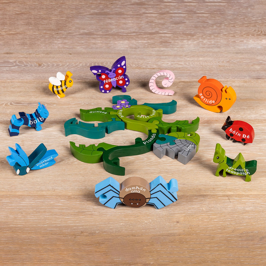 Wooden minibeast pieces from the Creepy Crawlies jigsaw standing up for play