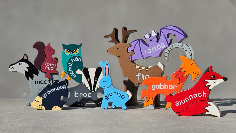 Child playing with the Irish Wildlife wooden jigsaw animal pieces