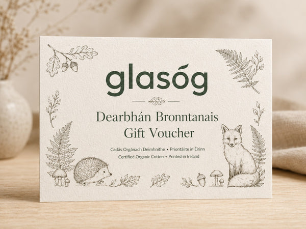 Glasóg Dearbhán Bronntanais gift voucher on thick cream card with woodland illustrations of a hedgehog and fox
