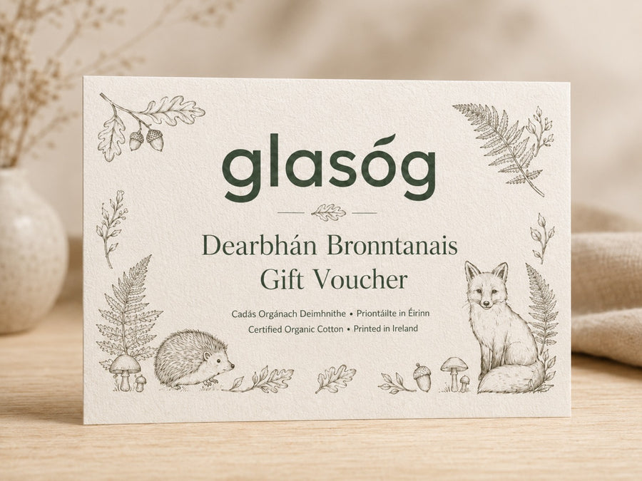 Glasóg Dearbhán Bronntanais gift voucher on thick cream card with woodland illustrations of a hedgehog and fox