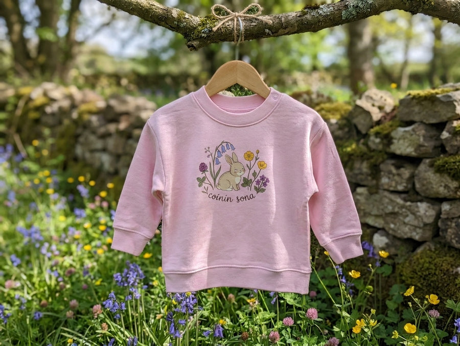 pink sweatshirt with rabbit-floral design