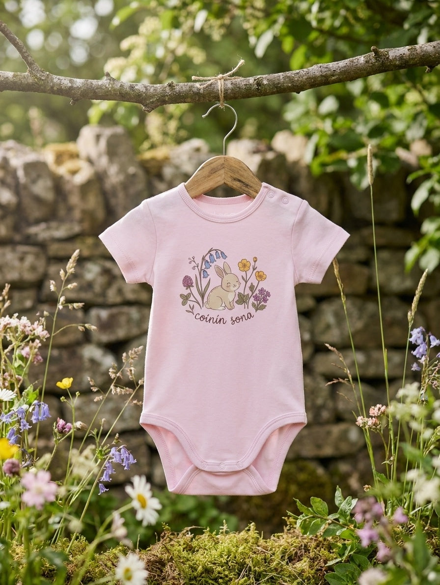 pink bodysuit with rabbit-floral design