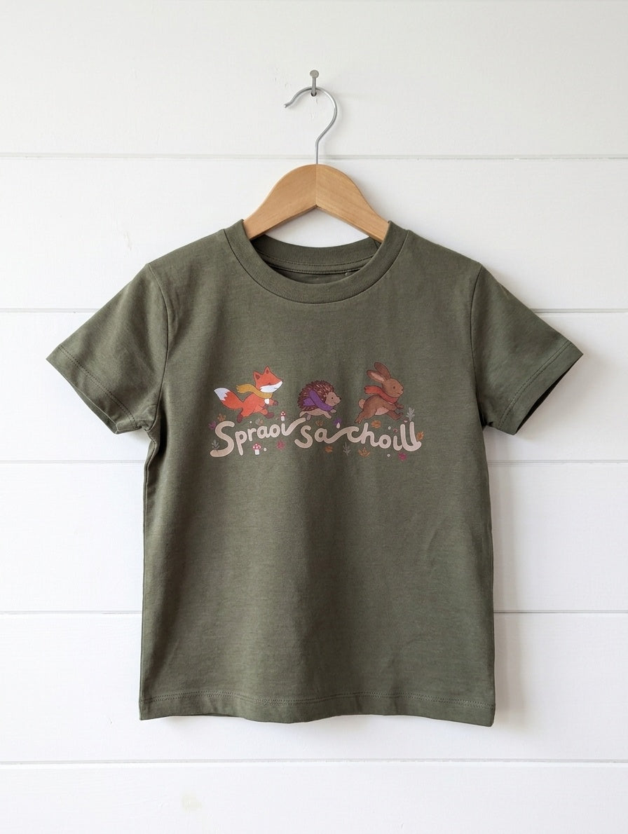 Olive kids t-shirt with Spraoi sa Choill forest design, hanger shiplap