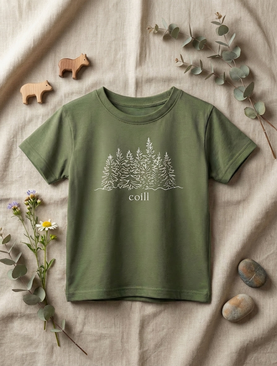 Flat lay of green t-shirt with trees design on natural leaf background