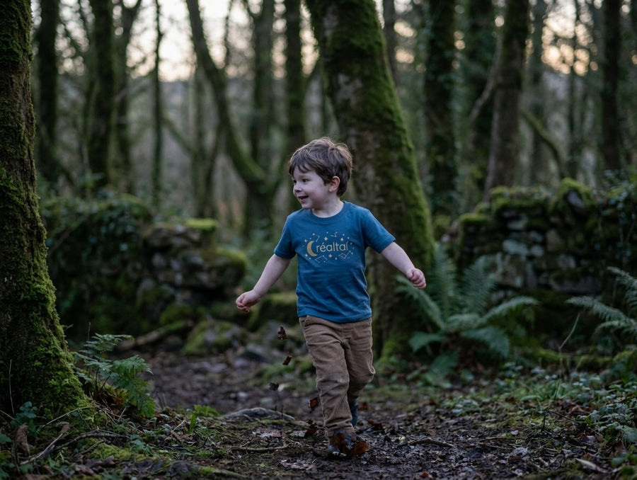 Child in motion wearing twilightblue t-shirt with stars design