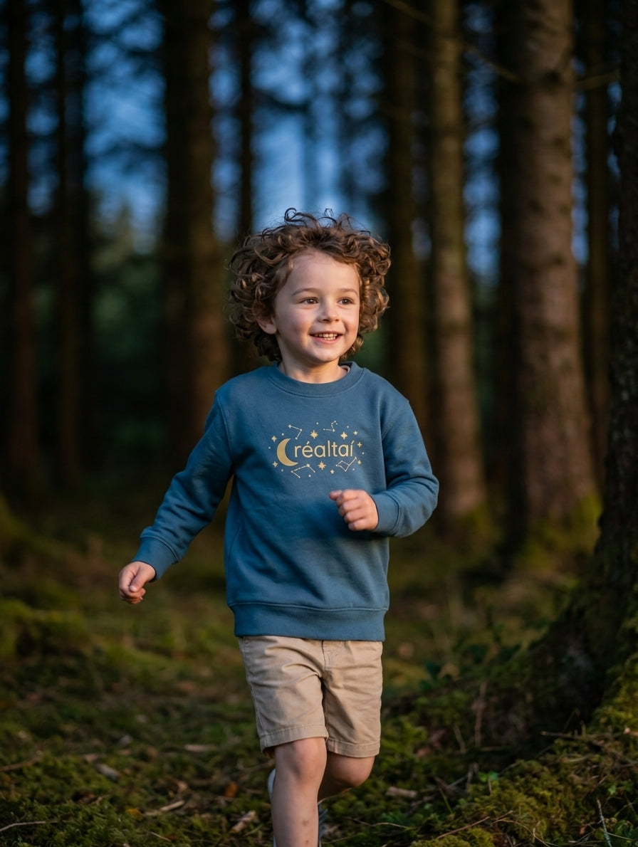 Child in motion wearing twilightblue sweatshirt with stars design
