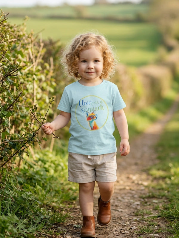 Baby wearing blue organic cotton t-shirt with fox illustration, portrait