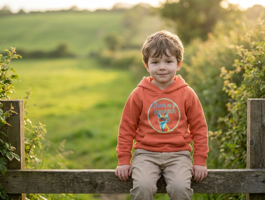 Child wearing orange hoodie with fox design, portrait