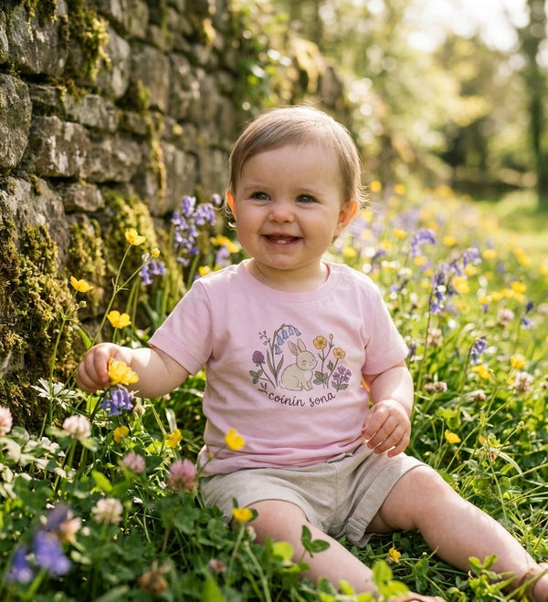 Child wearing pink t-shirt with rabbit-floral design, portrait