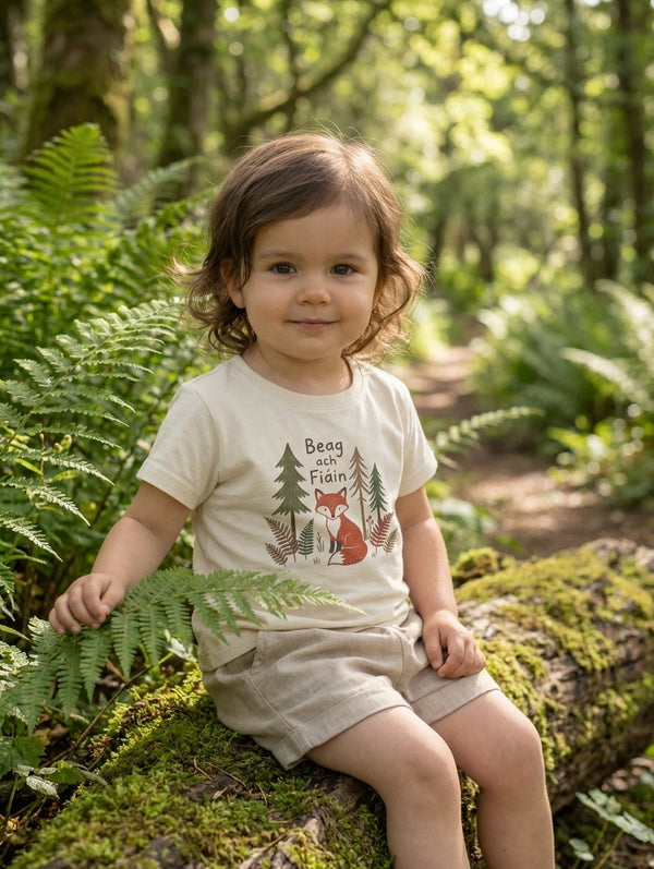 Child wearing oatmeal t-shirt with beagfiain design, portrait