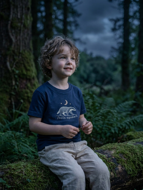 Child wearing navy t-shirt with faoin-ngealach design, portrait