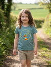 Child wearing teal t-shirt with fox design, portrait