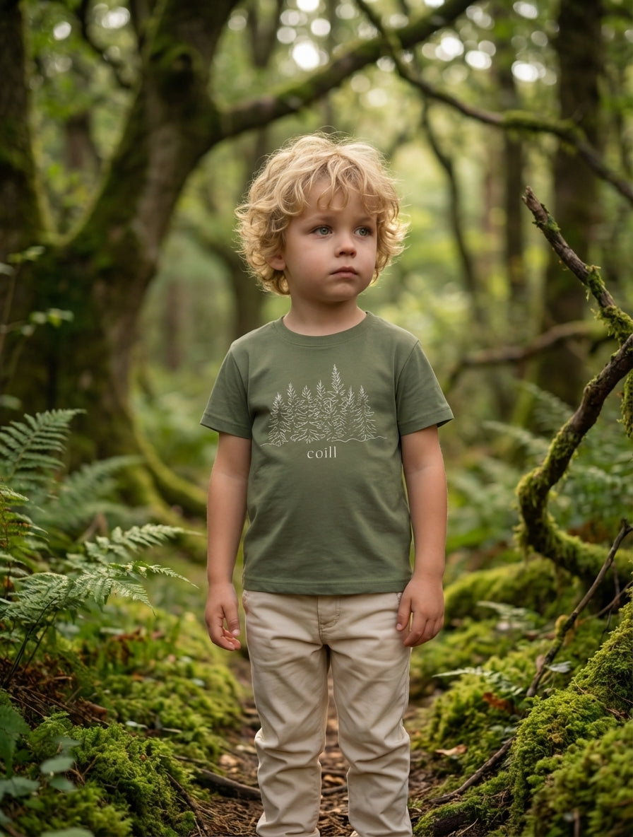 Child wearing green t-shirt with trees design, portrait