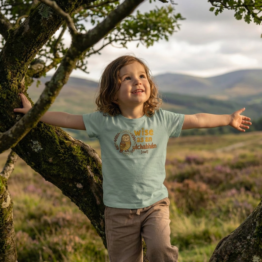 Styled lifestyle photo of seafoam kids t-shirt with owl illustration
