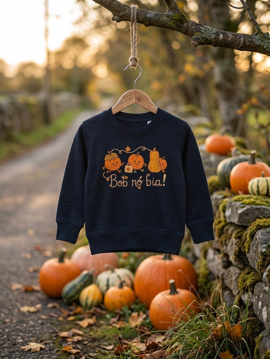 navy sweatshirt with Bob nó Bia pumpkins design hanging outdoors