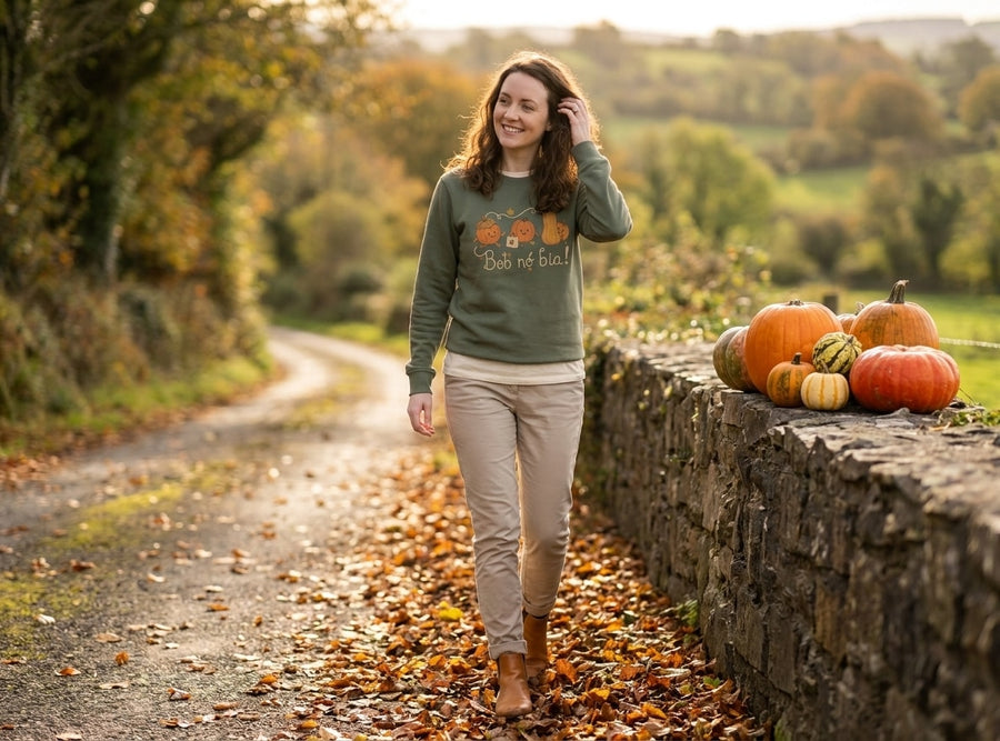 Woman walking a country lane in the olive Bob nó Bia adult sweatshirt