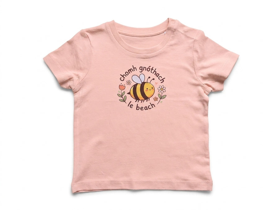 peach kids t-shirt with bee illustration on white background