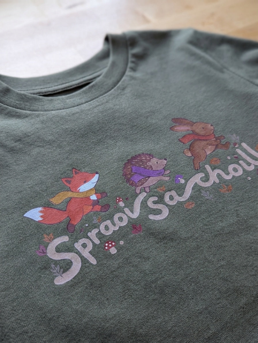 Olive kids t-shirt with Spraoi sa Choill forest design, up close detail