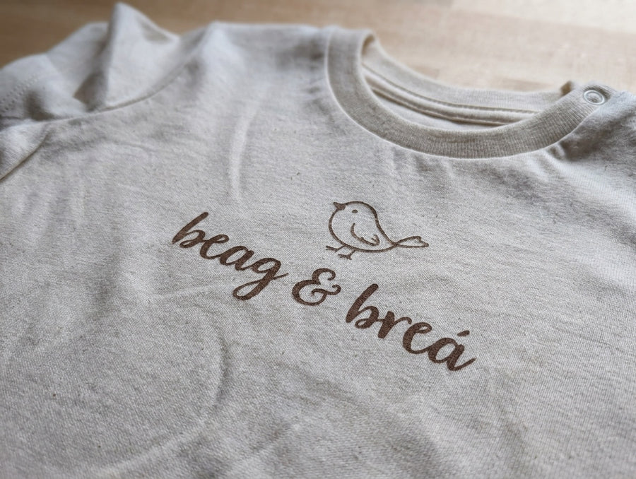 Close-up detail of beagbrea illustration on oatmeal t-shirt