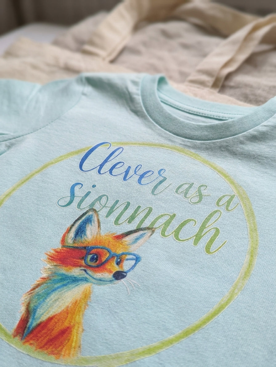 Close-up detail of fox illustration on blue baby t-shirt