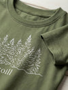 Close-up detail of trees illustration on green t-shirt