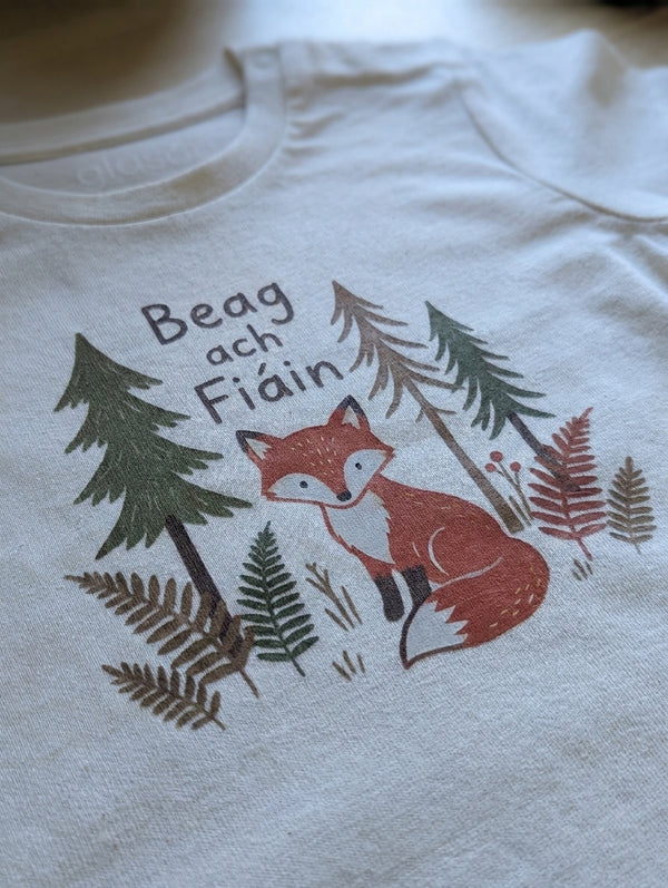 Close-up detail of beagfiain illustration on oatmeal t-shirt