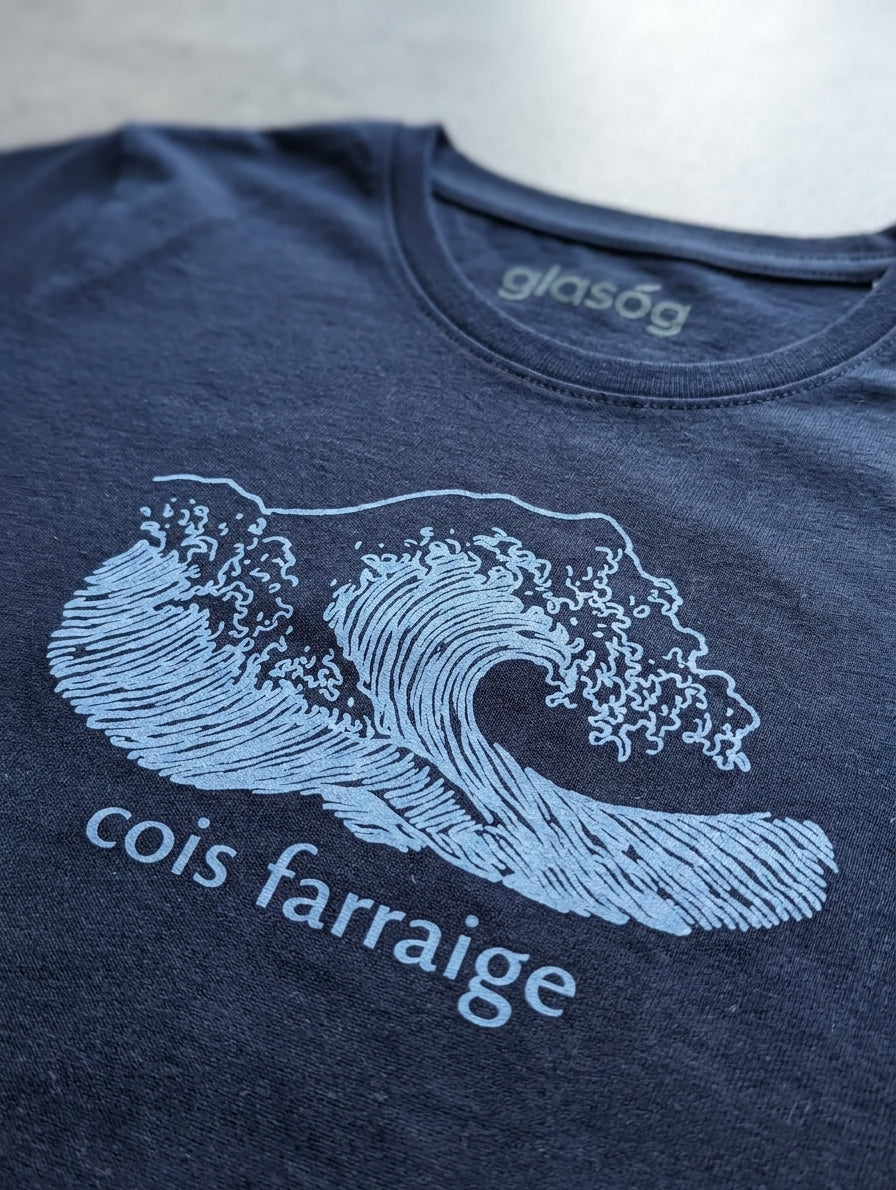 Close-up detail of wave illustration on navy t-shirt
